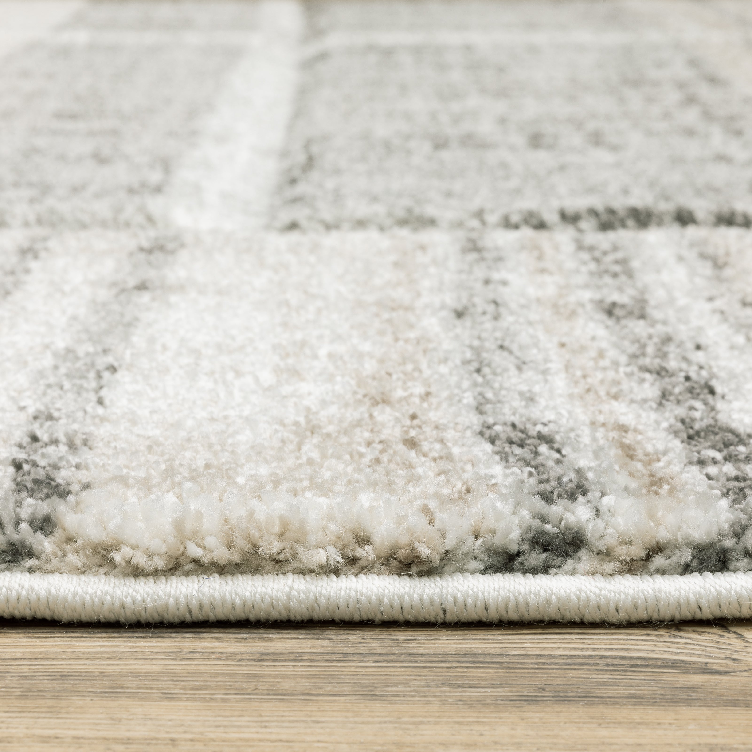 Oriental Weavers Cambria 055X2 plush modern rug featuring abstract pattern in tan/ charcoal tones