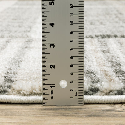 Oriental Weavers Cambria 055X2 plush modern rug featuring abstract pattern in tan/ charcoal tones