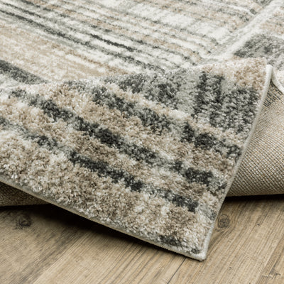 Oriental Weavers Cambria 055X2 plush modern rug featuring abstract pattern in tan/ charcoal tones