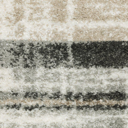Oriental Weavers Cambria 055X2 plush modern rug featuring abstract pattern in tan/ charcoal tones