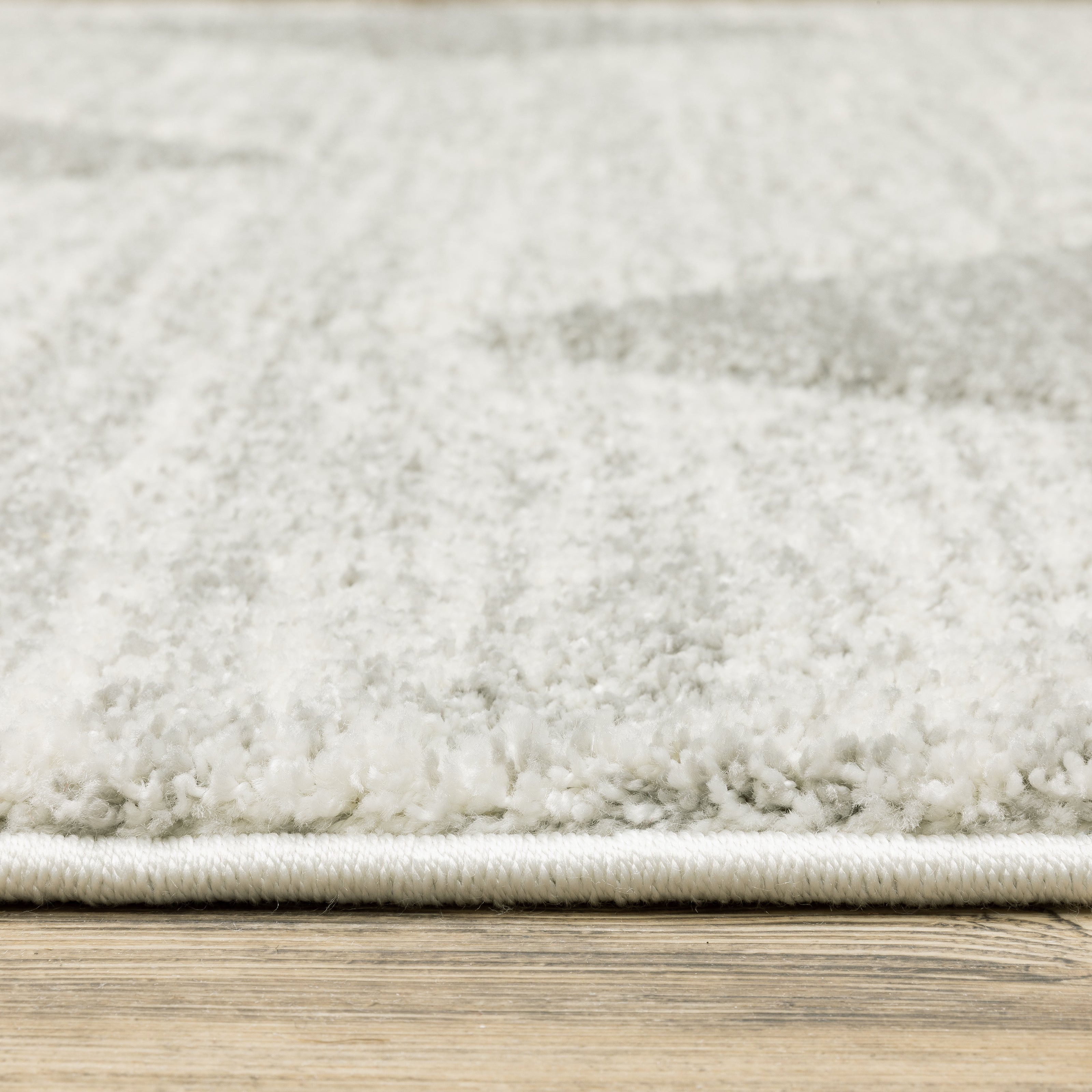 Oriental Weavers Cambria 005W2 plush modern rug featuring abstract pattern in grey/ ivory tones