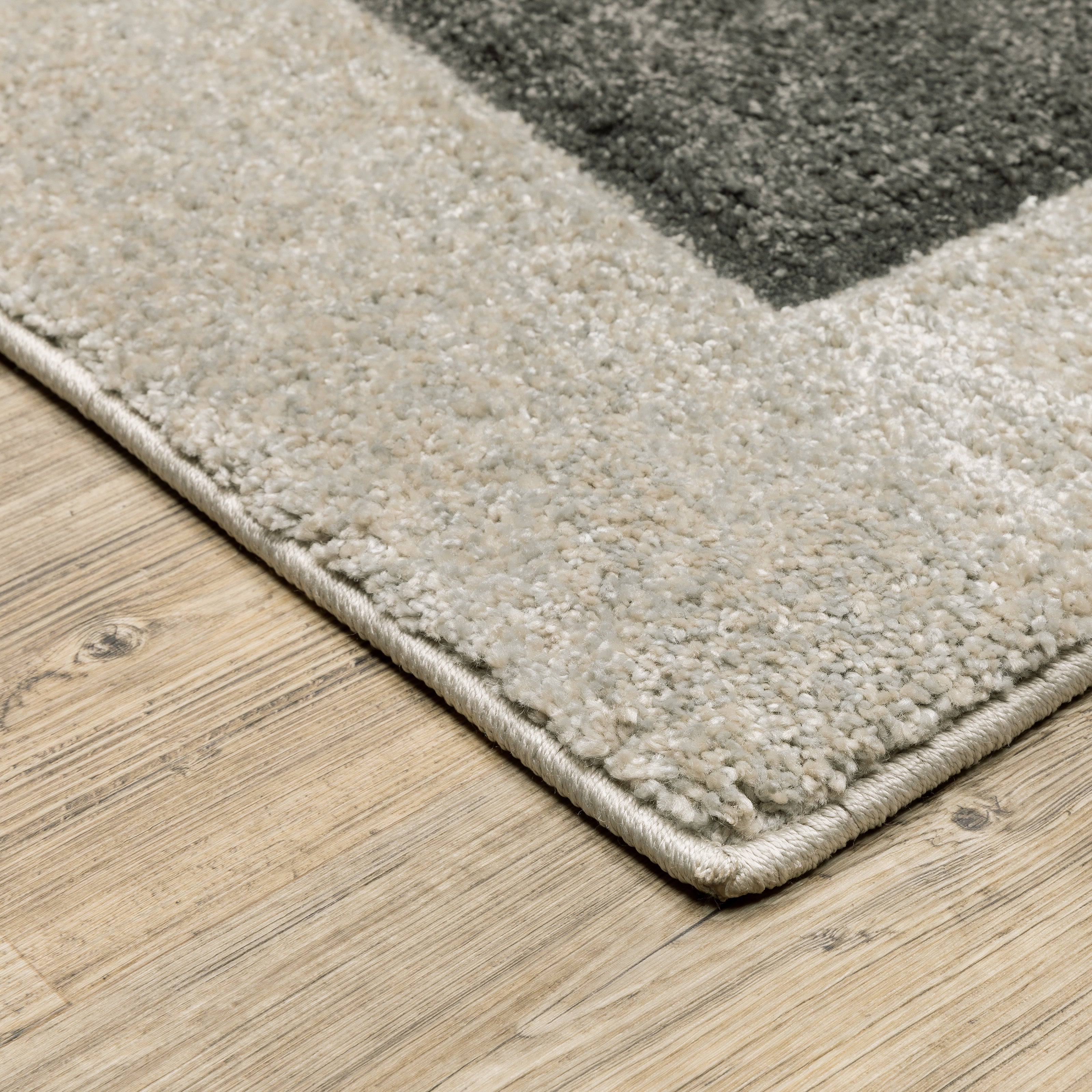 Oriental Weavers Cambria 084J2 plush modern rug featuring abstract pattern in beige/ multi tones