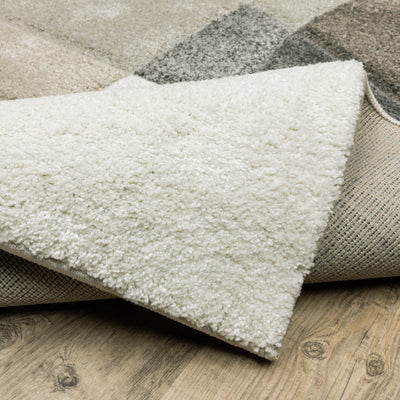 Oriental Weavers Cambria 084J2 plush modern rug featuring abstract pattern in beige/ multi tones