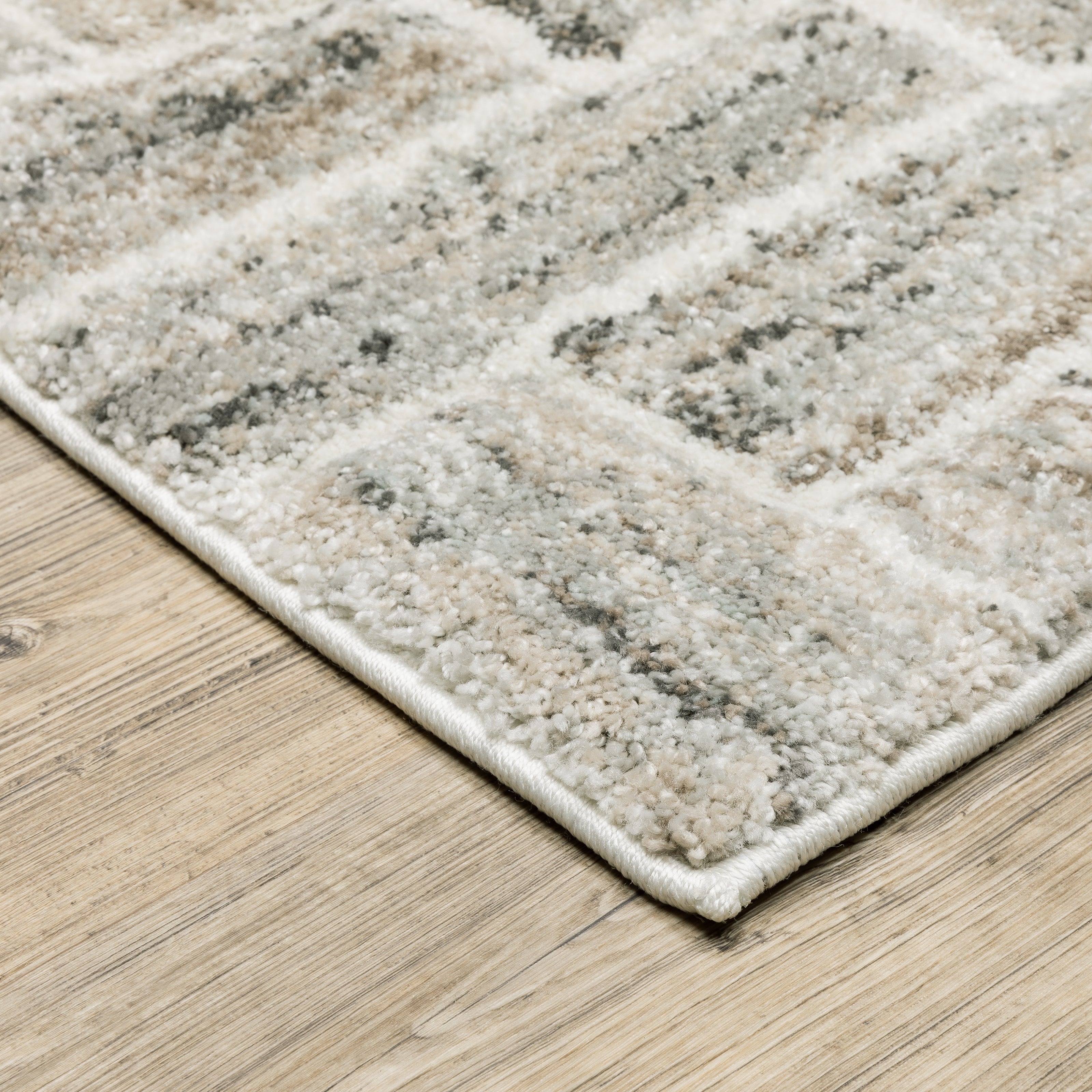 Oriental Weavers Cambria 093L2 plush modern rug featuring abstract pattern in ivory/ beige tones