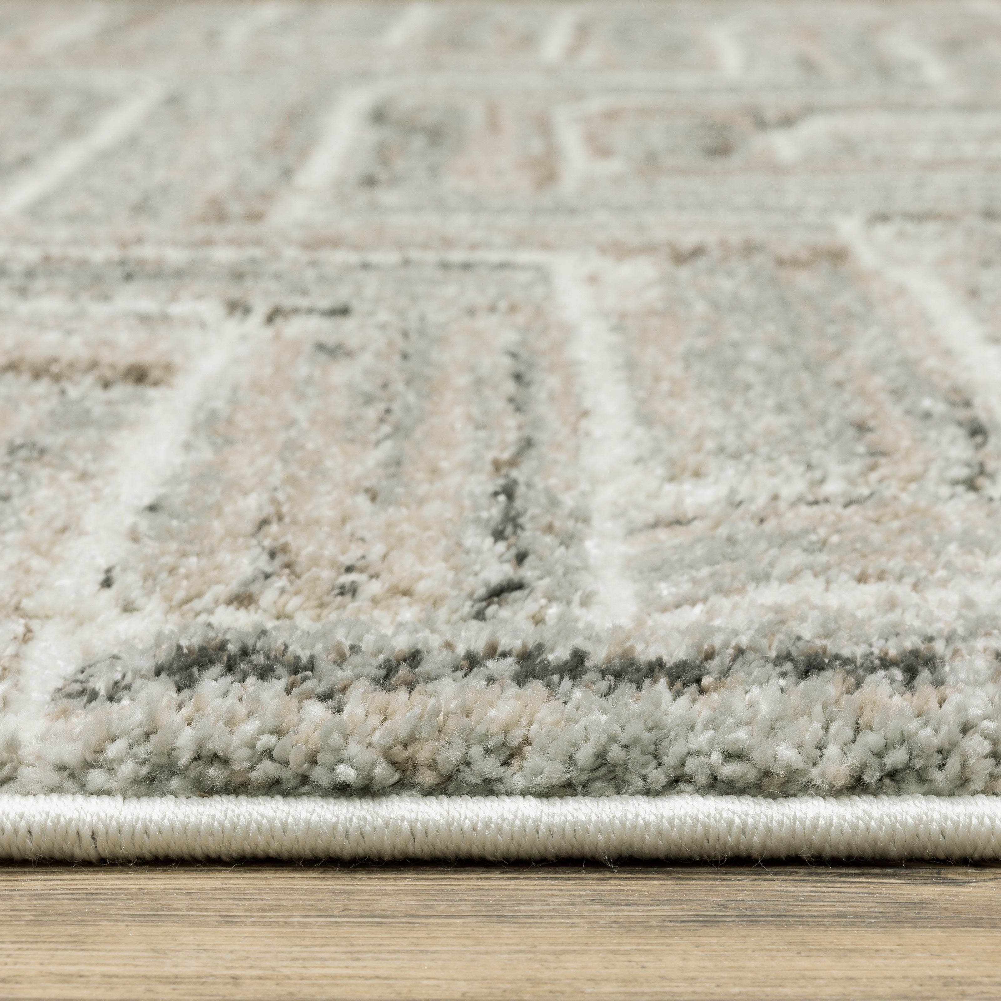 Oriental Weavers Cambria 093L2 plush modern rug featuring abstract pattern in ivory/ beige tones