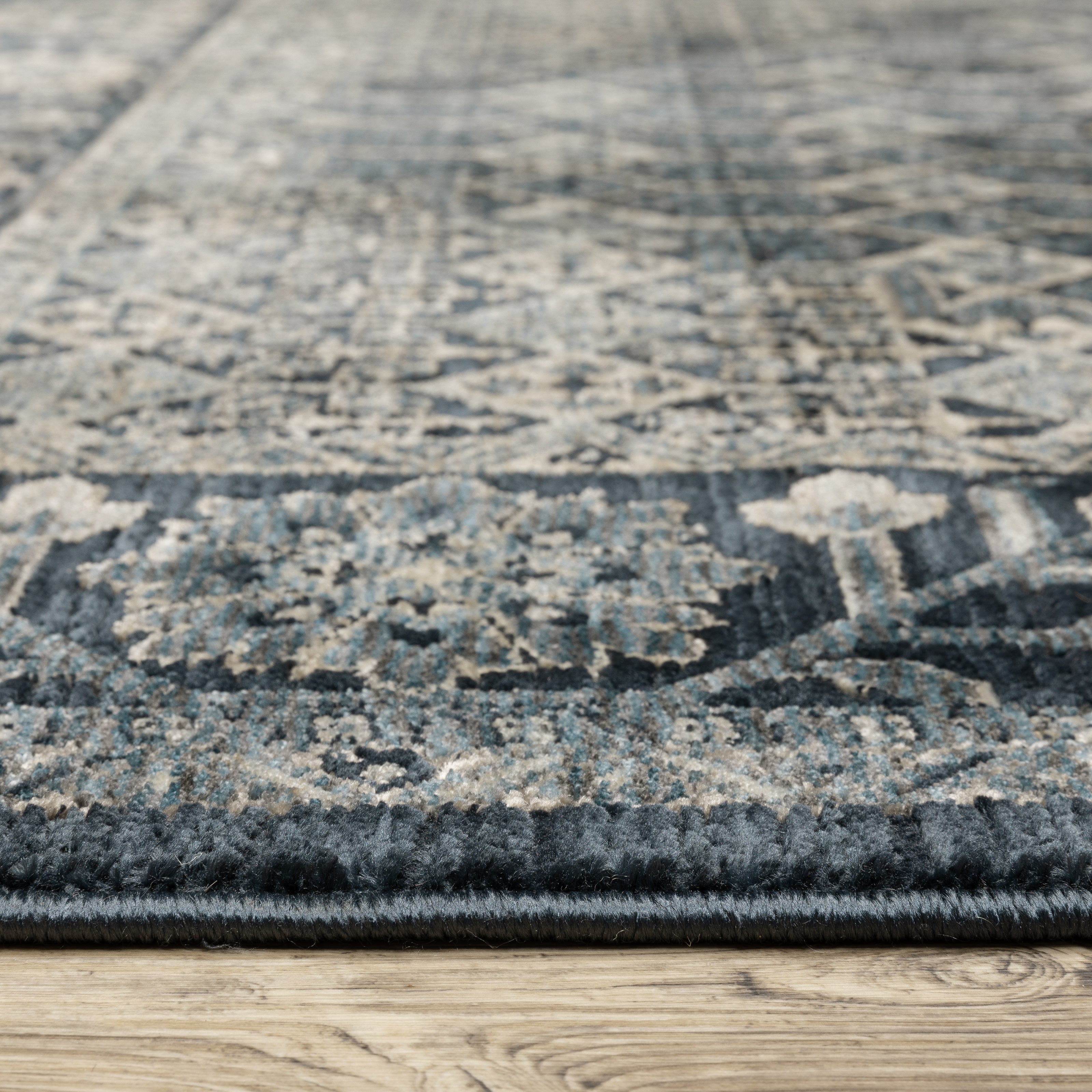 Oriental Weavers Capella CAP03 soft transitional rug featuring textured design in deep blue/ ivory tones