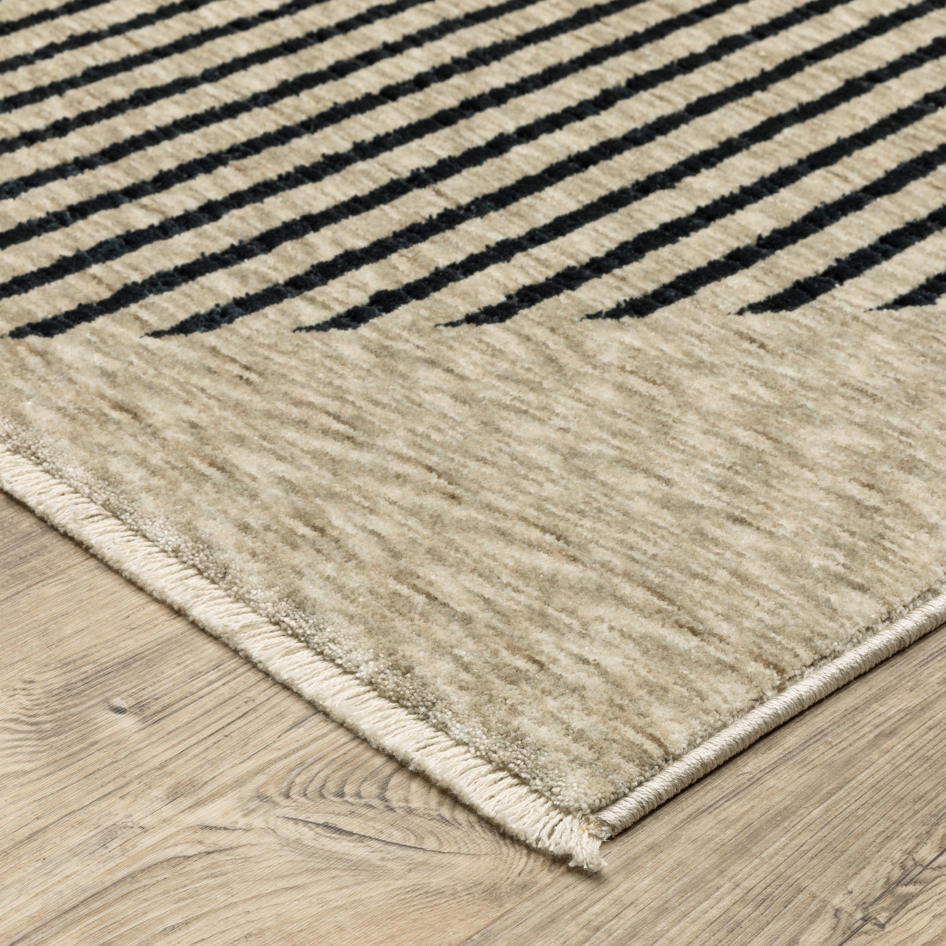 Oriental Weavers Capella CAP04 soft transitional rug featuring textured design in beige/ deep navy tones