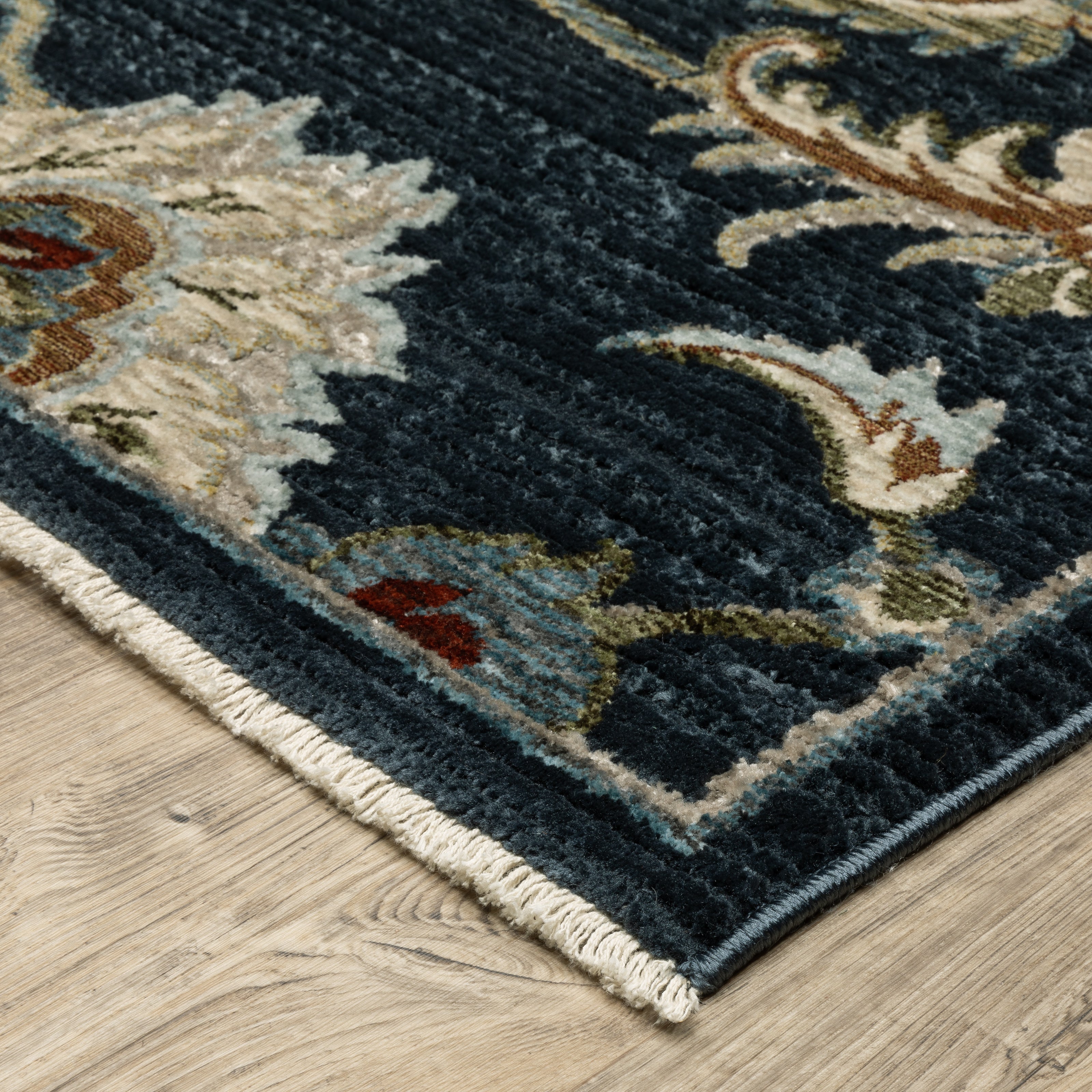 Oriental Weavers Capella CAP05 soft transitional rug featuring textured design in navy blue/ multi tones