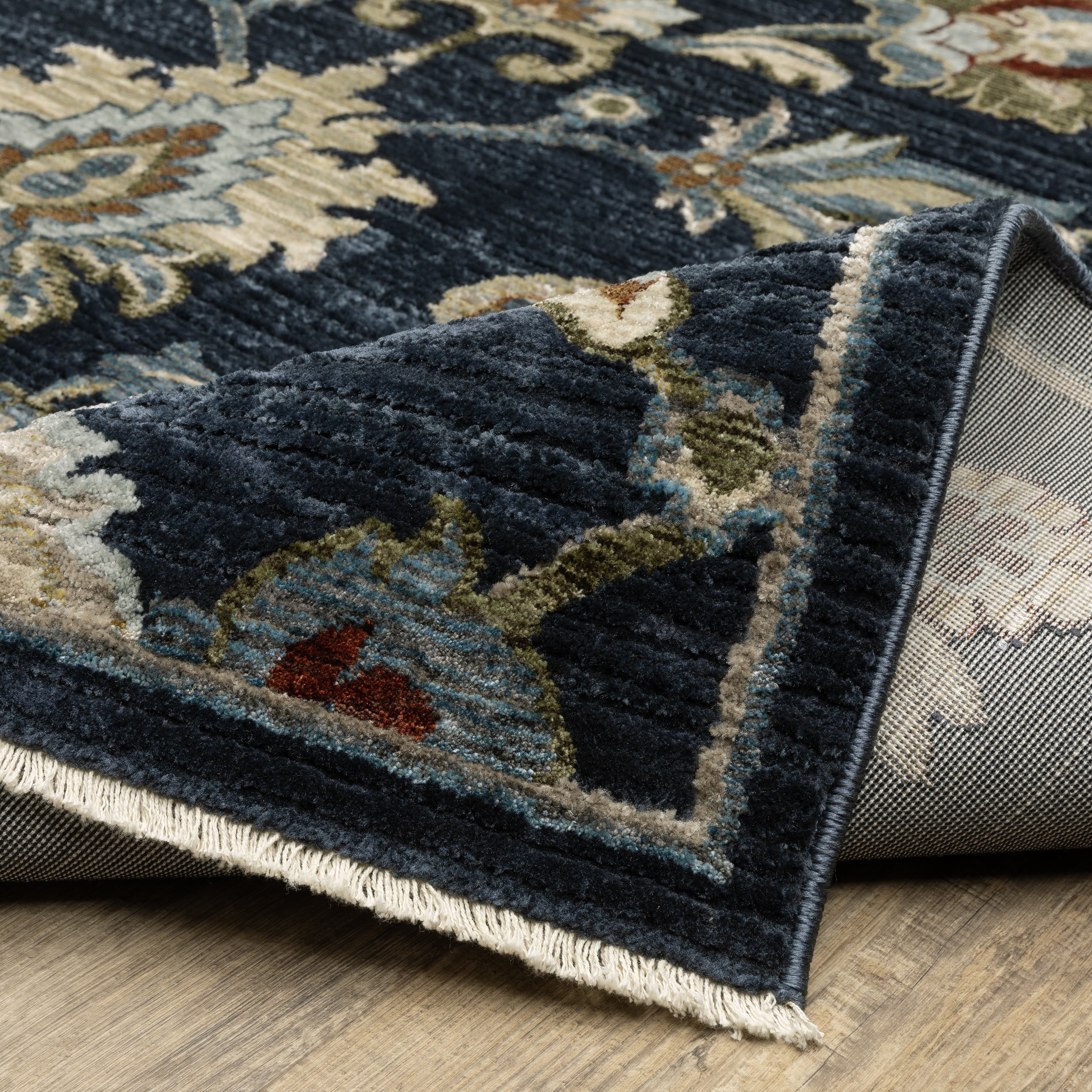 Oriental Weavers Capella CAP05 soft transitional rug featuring textured design in navy blue/ multi tones