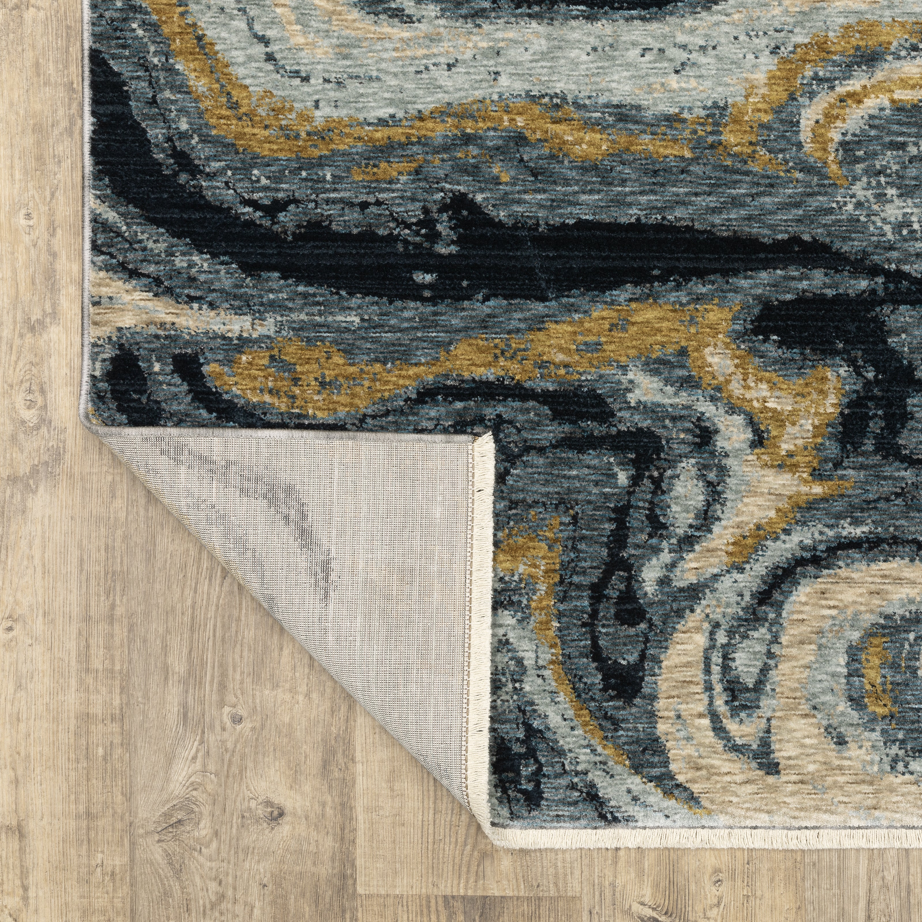 Oriental Weavers Capella CAP10 soft transitional rug featuring textured design in navy blue/ teal tones