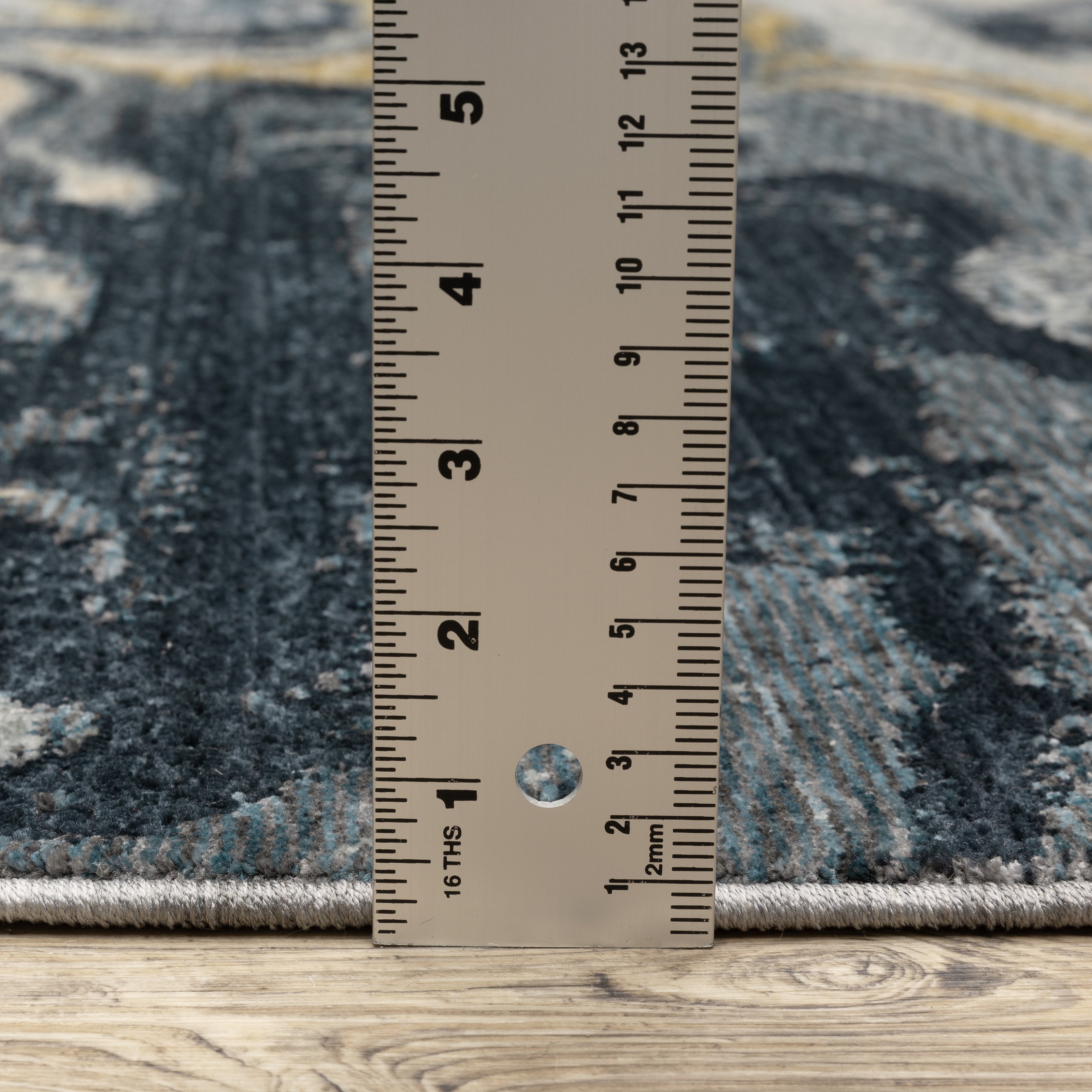 Oriental Weavers Capella CAP10 soft transitional rug featuring textured design in navy blue/ teal tones