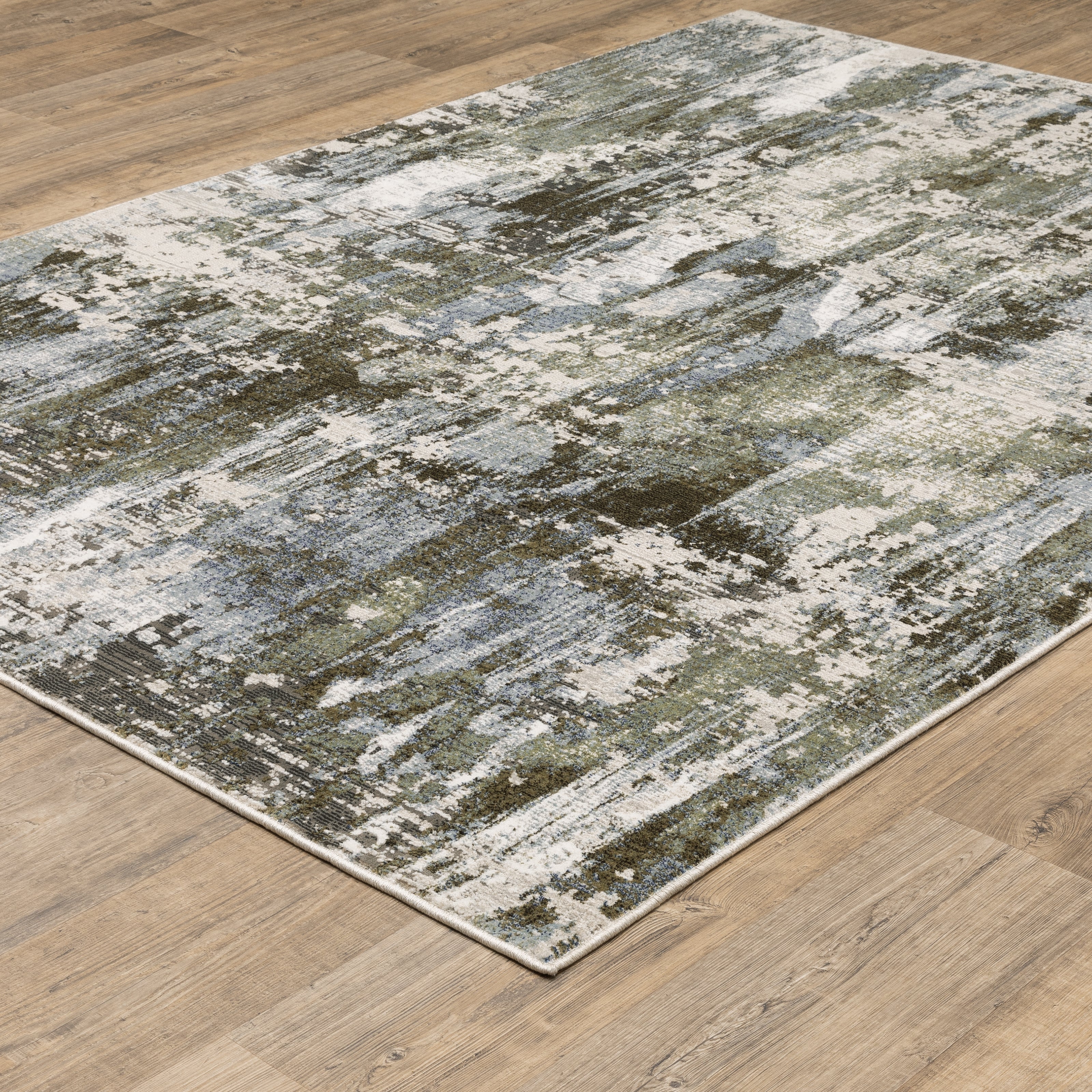 Oriental Weavers Caravan 2060F soft area rug featuring textured design in green/ blue tones
