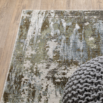 Oriental Weavers Caravan 2060F soft area rug featuring textured design in green/ blue tones