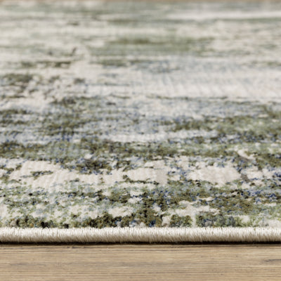 Oriental Weavers Caravan 2060F soft area rug featuring textured design in green/ blue tones