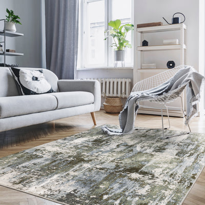 Oriental Weavers Caravan 2060F soft area rug featuring textured design in green/ blue tones