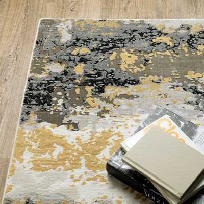 Oriental Weavers Caravan 2061X soft area rug featuring textured design in grey/ gold tones