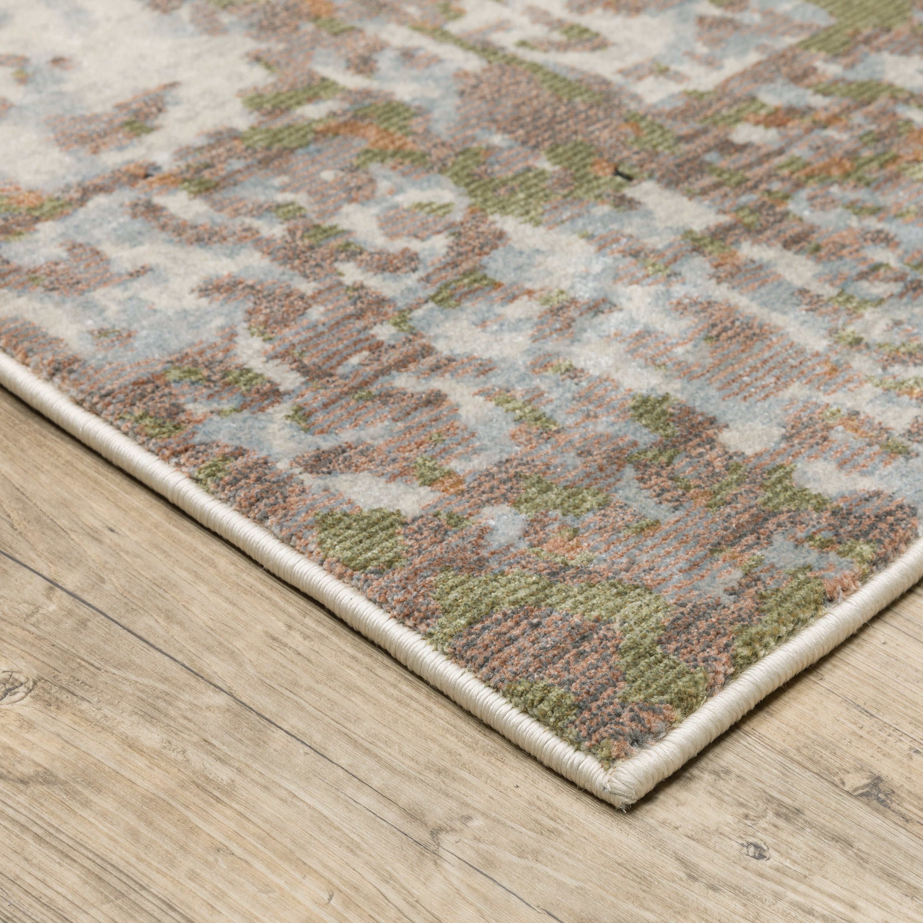 Oriental Weavers Caravan 4150Z soft modern rug featuring textured design in grey/ pink tones