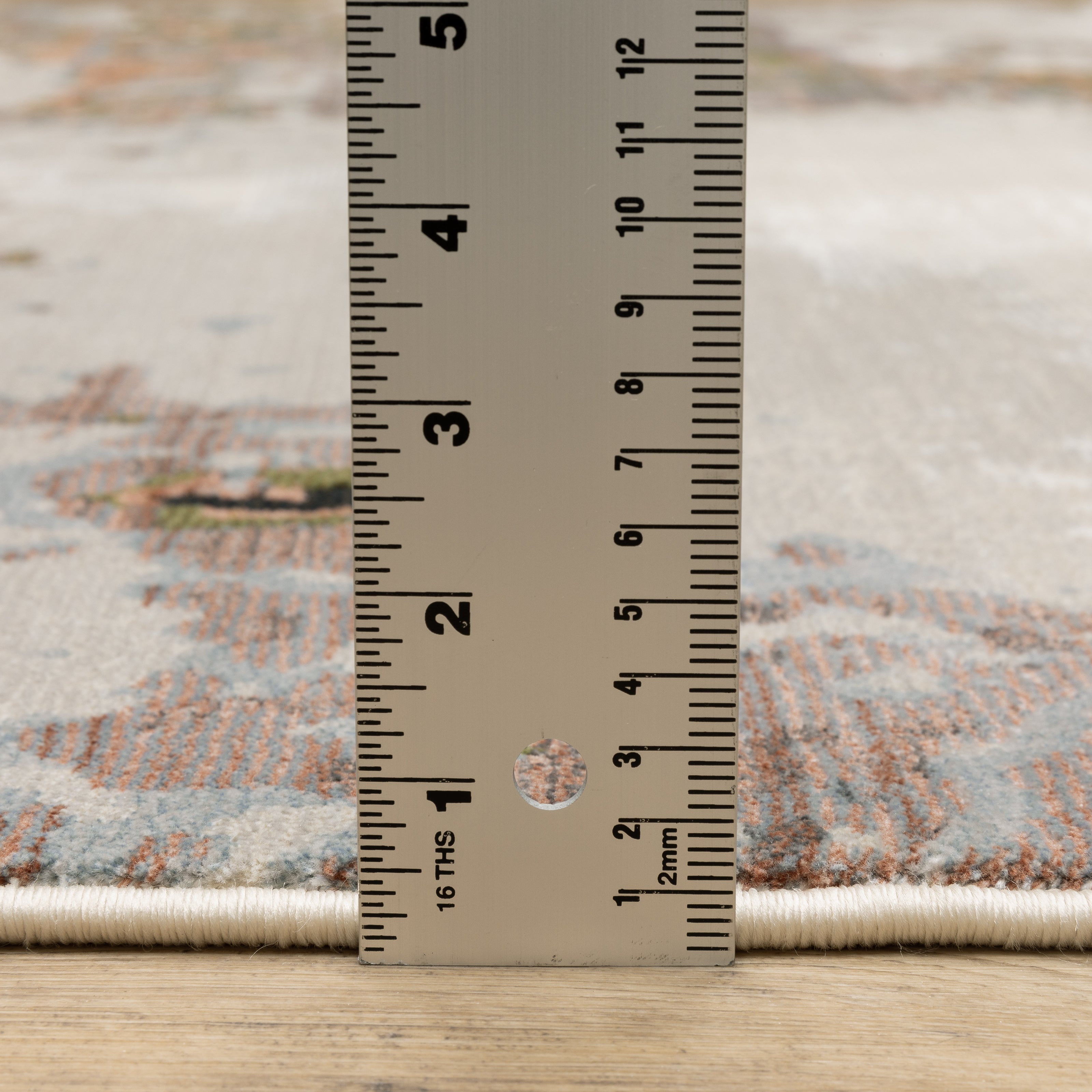Oriental Weavers Caravan 4150Z soft modern rug featuring textured design in grey/ pink tones