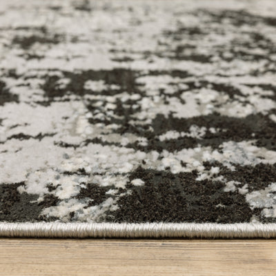 Oriental Weavers Caravan 4153Q soft area rug featuring textured design in grey/ black tones