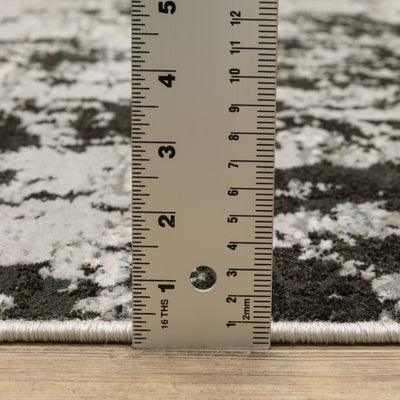 Oriental Weavers Caravan 4153Q soft area rug featuring textured design in grey/ black tones