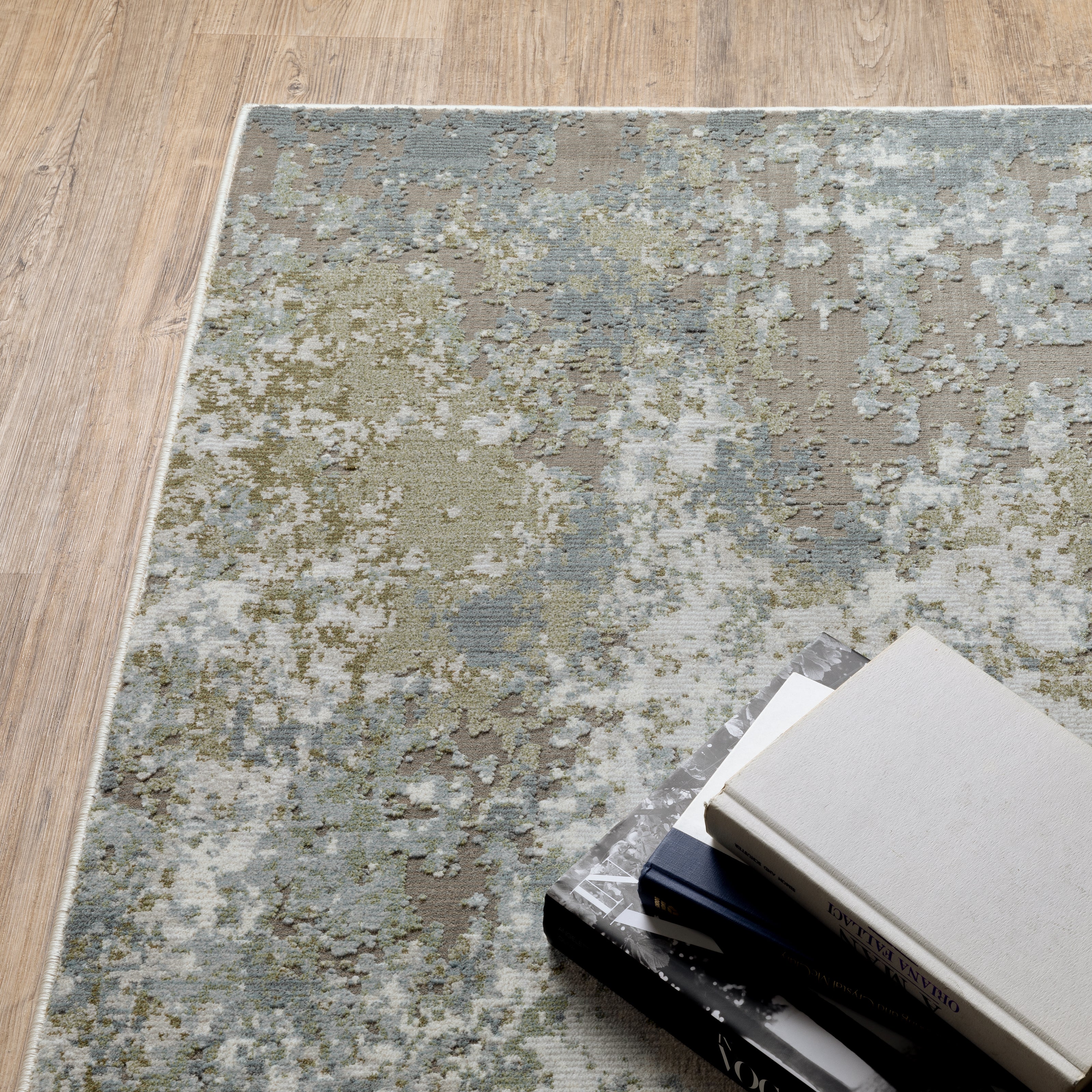 Oriental Weavers Caravan 5090E soft area rug featuring textured design in blue/ green tones