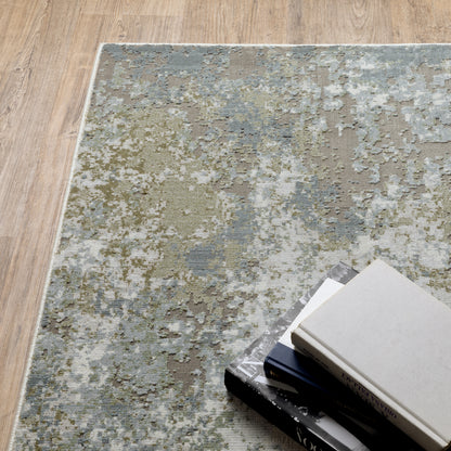 Oriental Weavers Caravan 5090E soft area rug featuring textured design in blue/ green tones