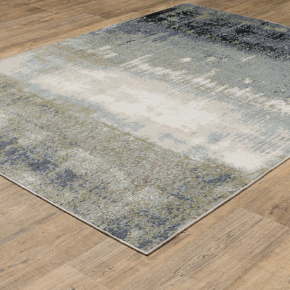 Oriental Weavers Caravan 5571H soft area rug featuring textured design in blue/ green tones