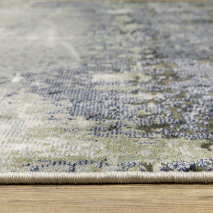 Oriental Weavers Caravan 5571H soft area rug featuring textured design in blue/ green tones