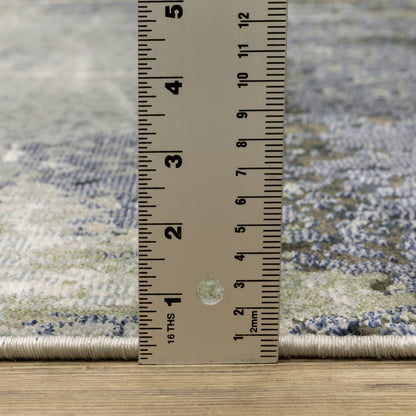Oriental Weavers Caravan 5571H soft area rug featuring textured design in blue/ green tones
