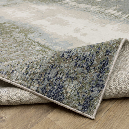 Oriental Weavers Caravan 5571H soft area rug featuring textured design in blue/ green tones