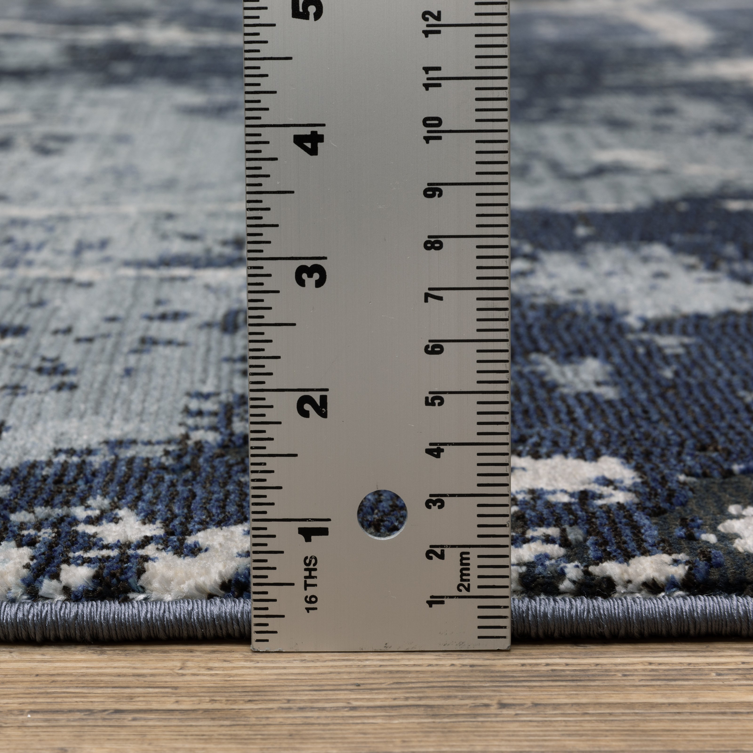 Oriental Weavers Caravan 7150B soft area rug featuring textured design in blue/ grey tones