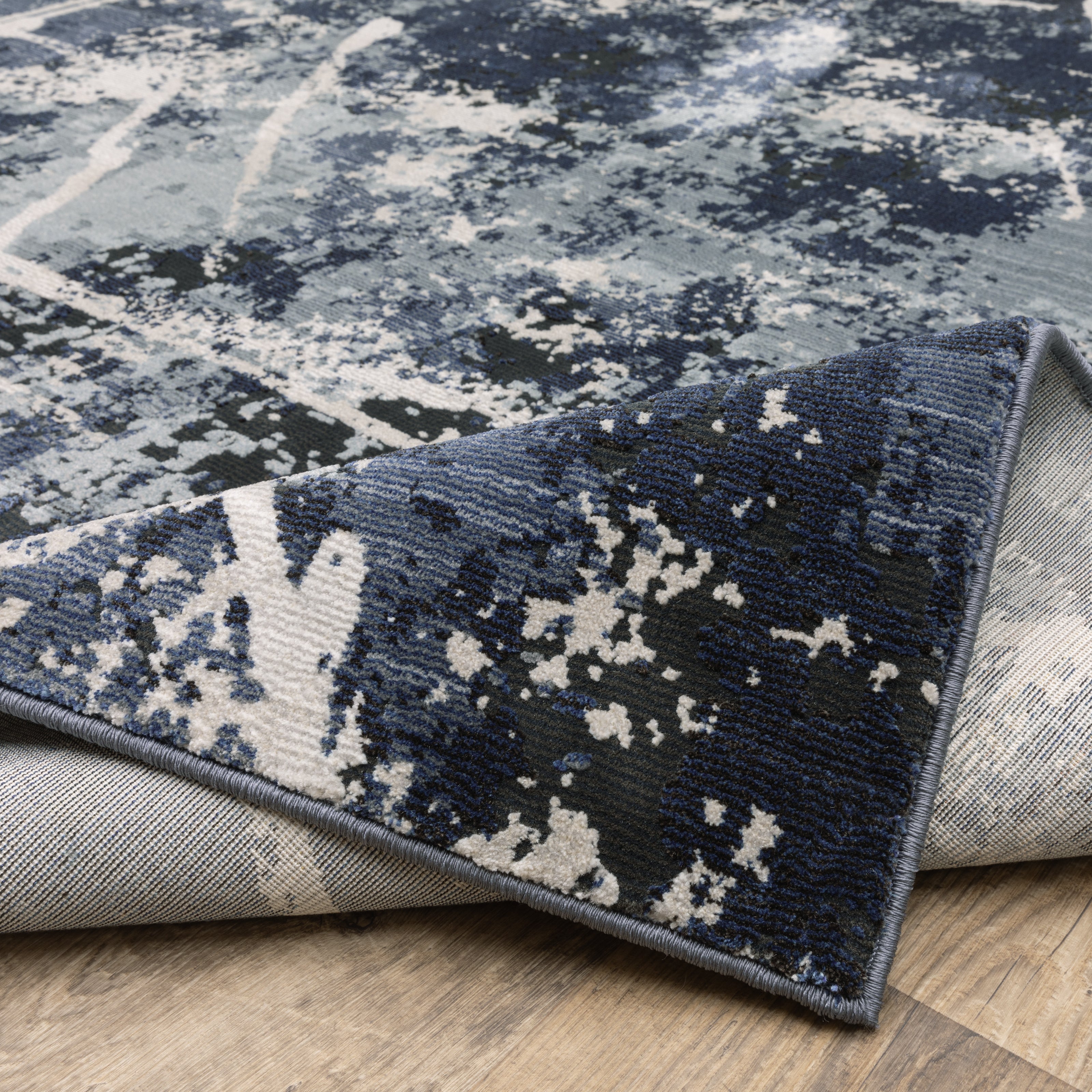 Oriental Weavers Caravan 7150B soft area rug featuring textured design in blue/ grey tones