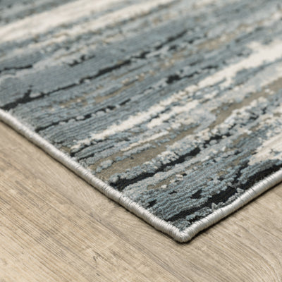Oriental Weavers Caravan 750W8 soft area rug featuring textured design in blue/ grey tones