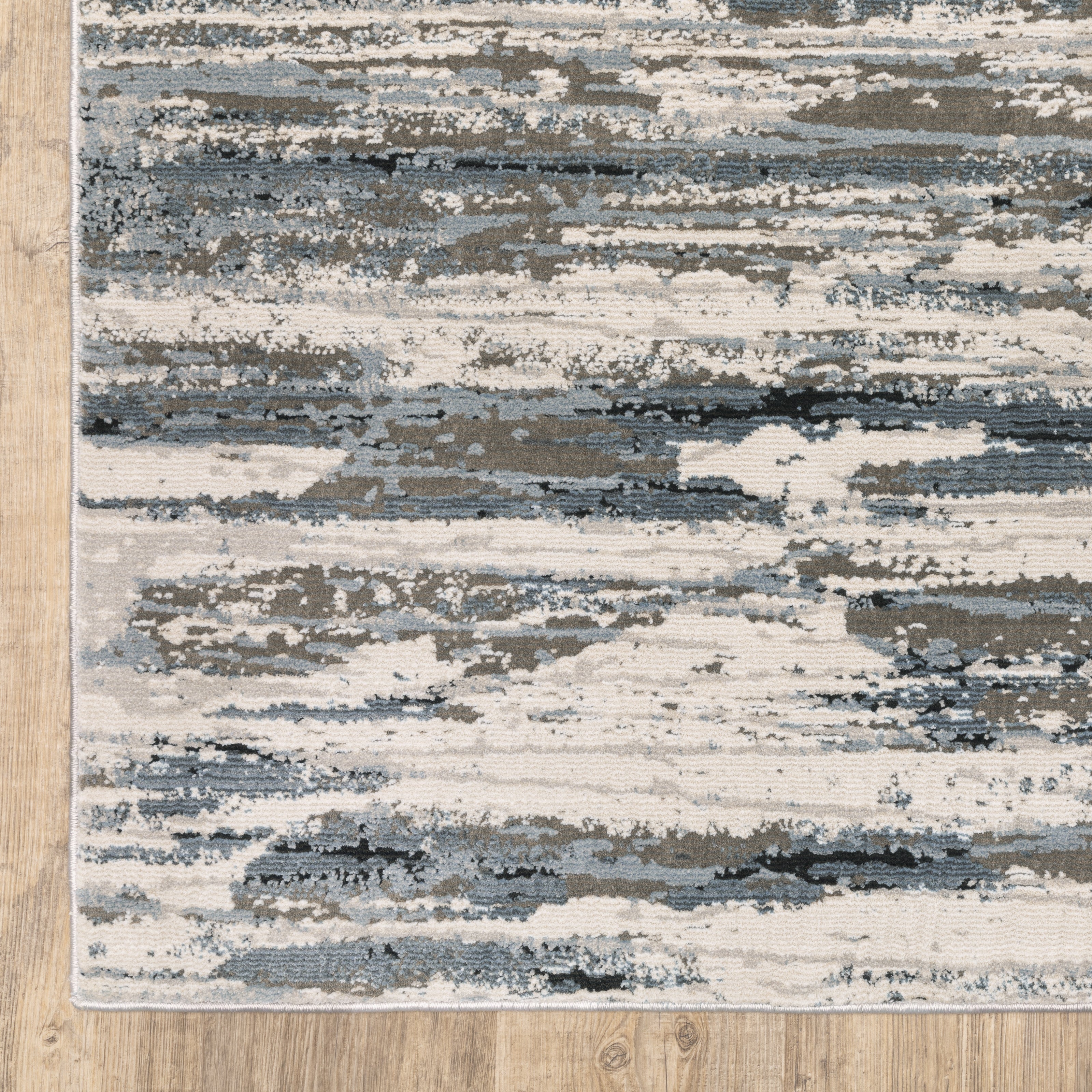 Oriental Weavers Caravan 750W8 soft area rug featuring textured design in blue/ grey tones