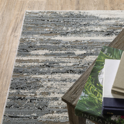 Oriental Weavers Caravan 750W8 soft area rug featuring textured design in blue/ grey tones