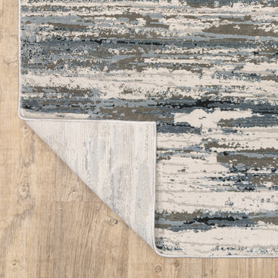 Oriental Weavers Caravan 750W8 soft area rug featuring textured design in blue/ grey tones