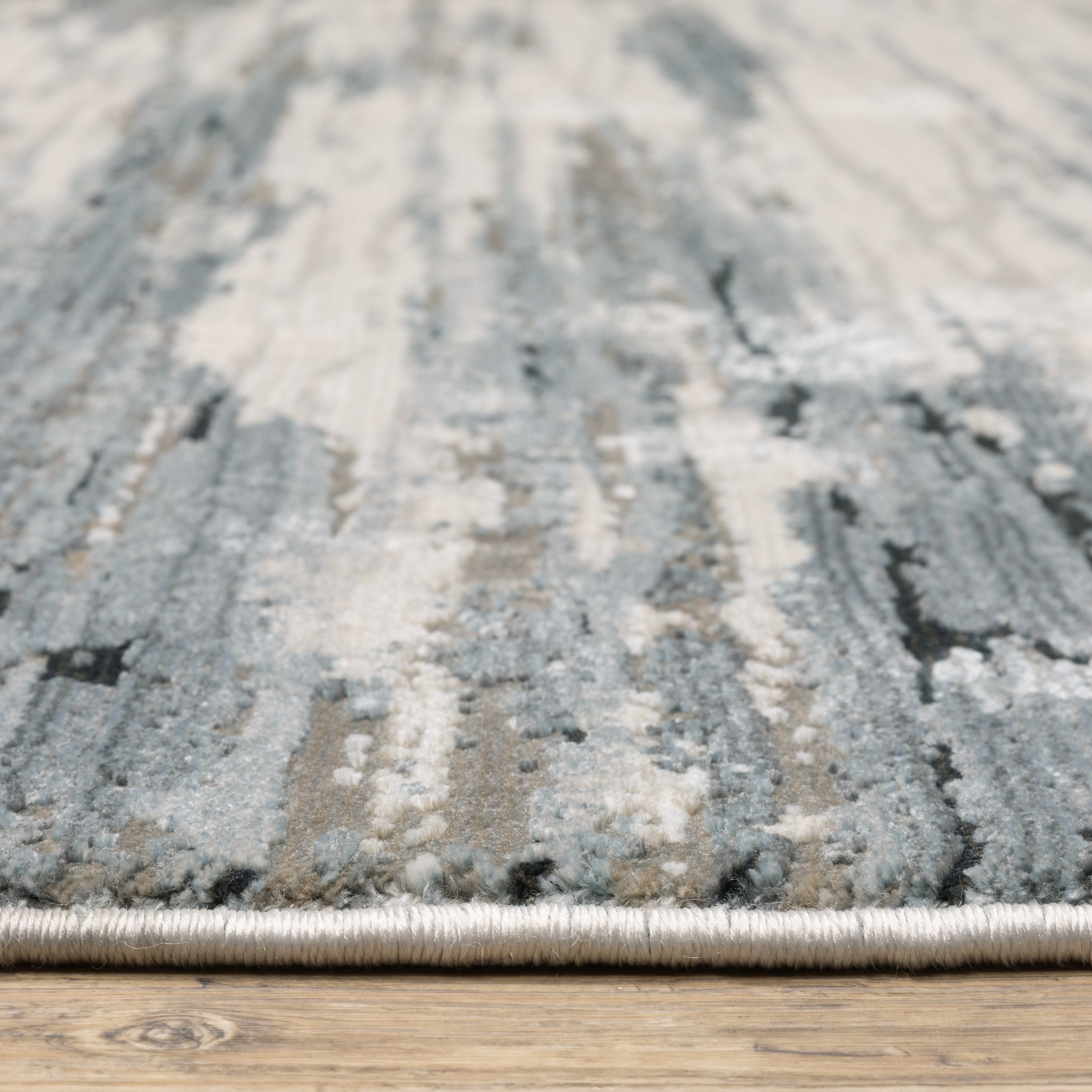 Oriental Weavers Caravan 750W8 soft area rug featuring textured design in blue/ grey tones