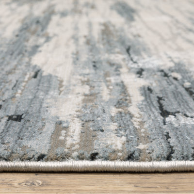 Oriental Weavers Caravan 750W8 soft area rug featuring textured design in blue/ grey tones