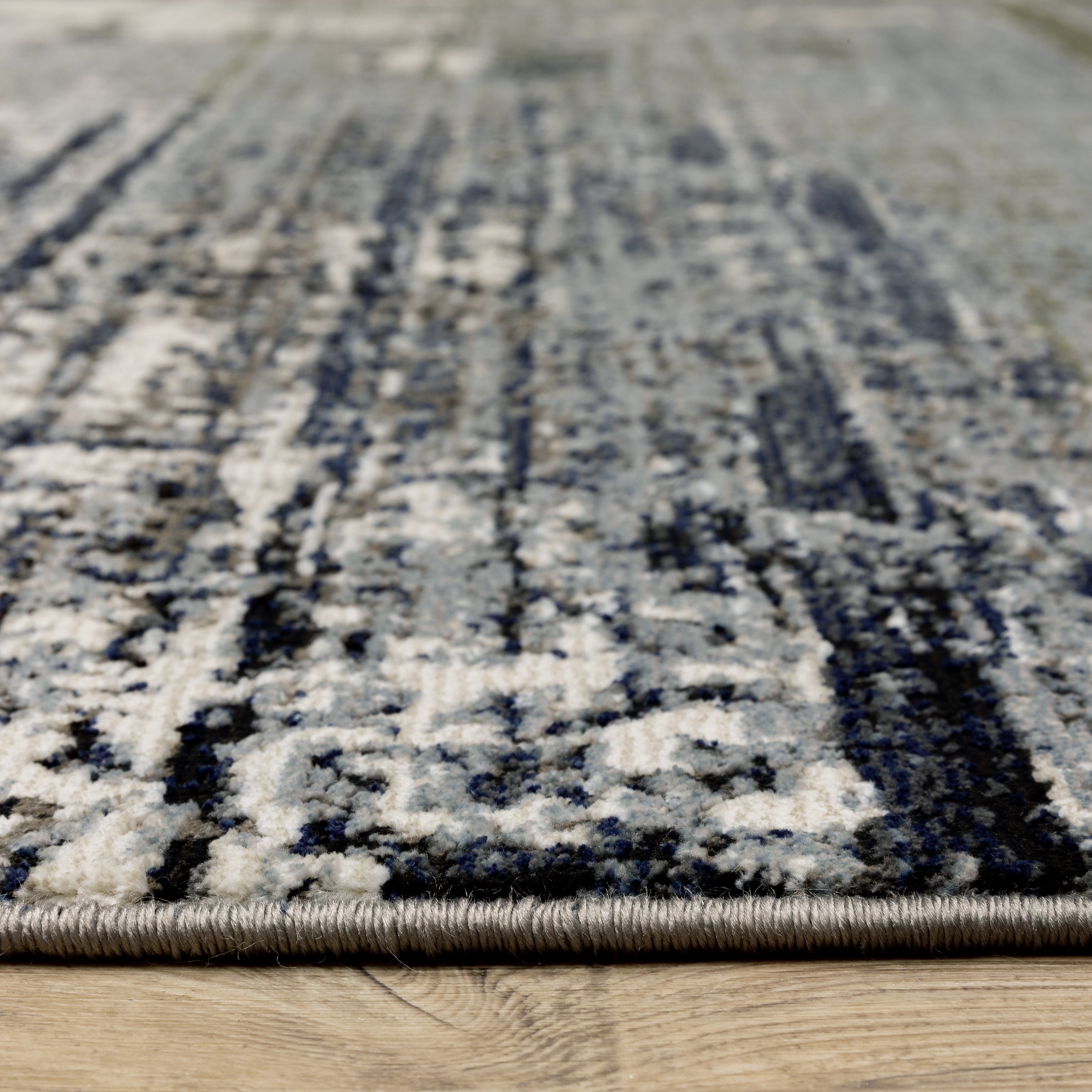Oriental Weavers Caravan 8020L soft area rug featuring textured design in blue/ green tones