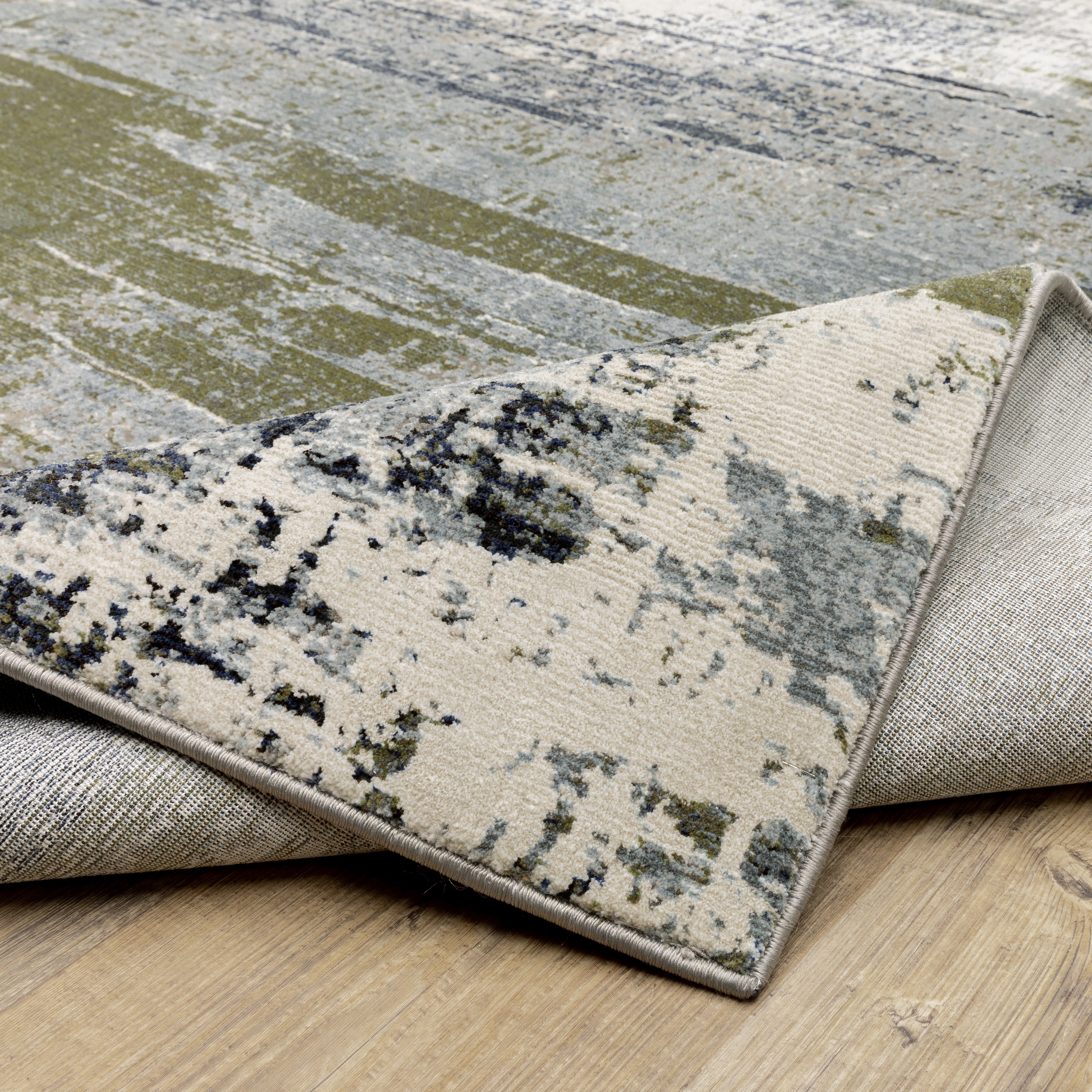 Oriental Weavers Caravan 8020L soft area rug featuring textured design in blue/ green tones