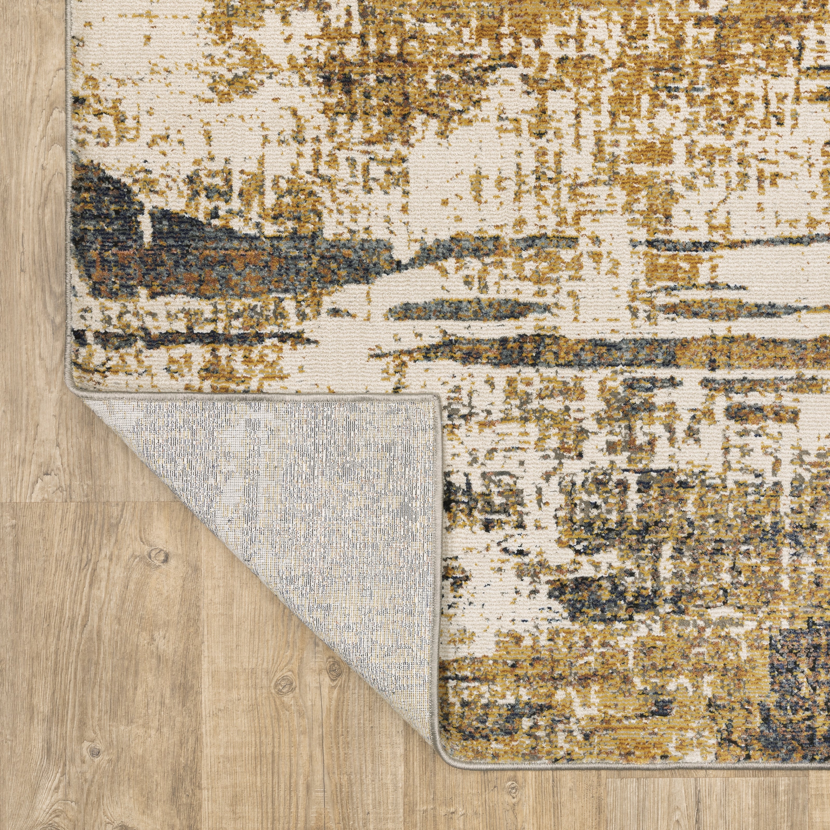 Oriental Weavers Caravan 8020X soft traditional rug featuring textured design in gold/ brown tones