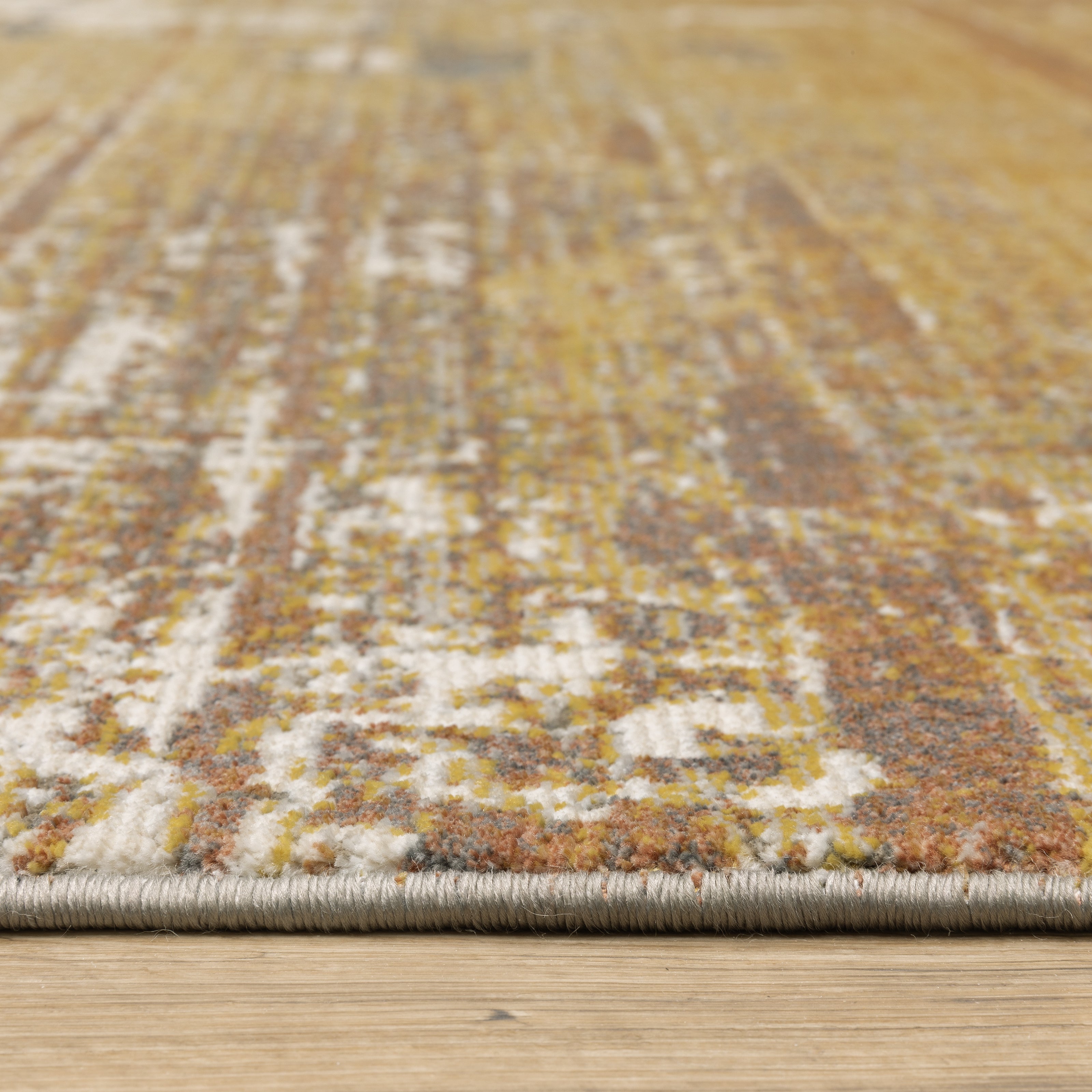 Oriental Weavers Caravan 8020X soft traditional rug featuring textured design in gold/ brown tones