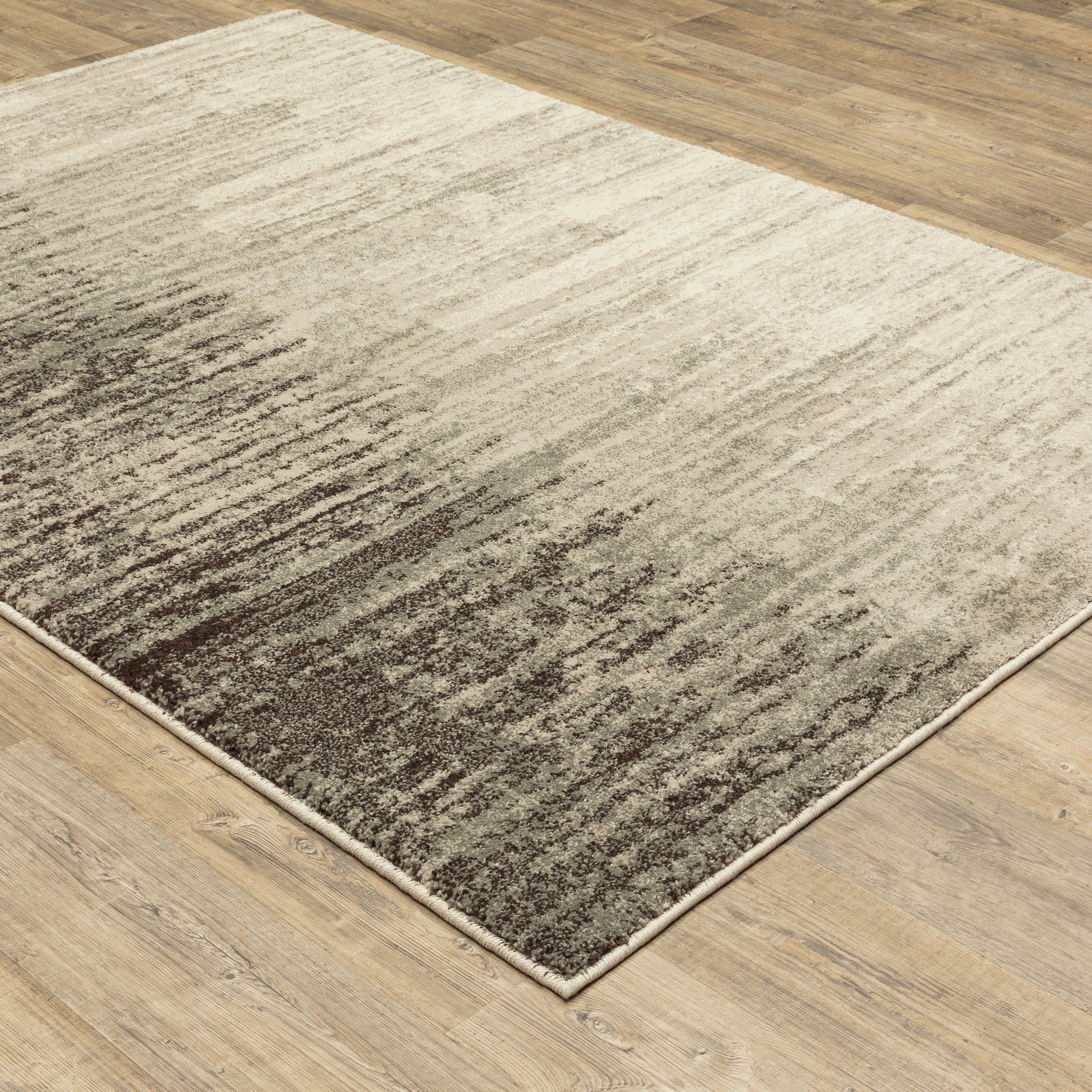 Oriental Weavers Carson 0735A plush modern rug featuring abstract pattern in beige/ grey tones