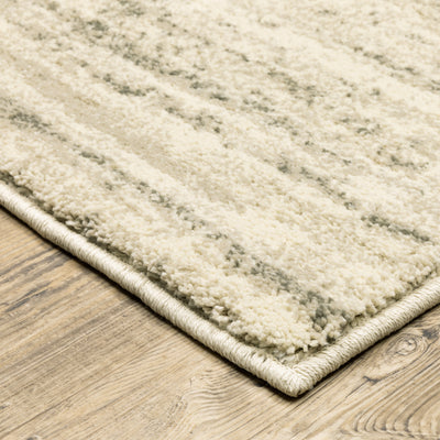 Oriental Weavers Carson 0735A plush modern rug featuring abstract pattern in beige/ grey tones