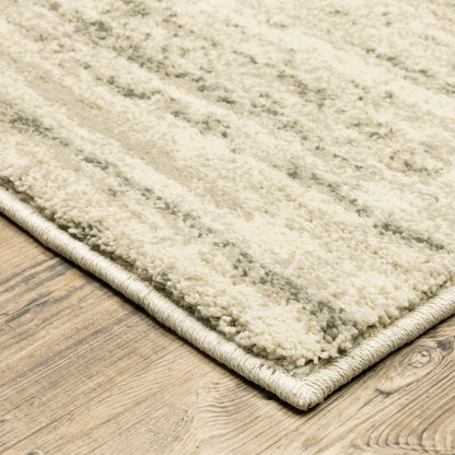 Oriental Weavers Carson 0735A plush modern rug featuring abstract pattern in beige/ grey tones