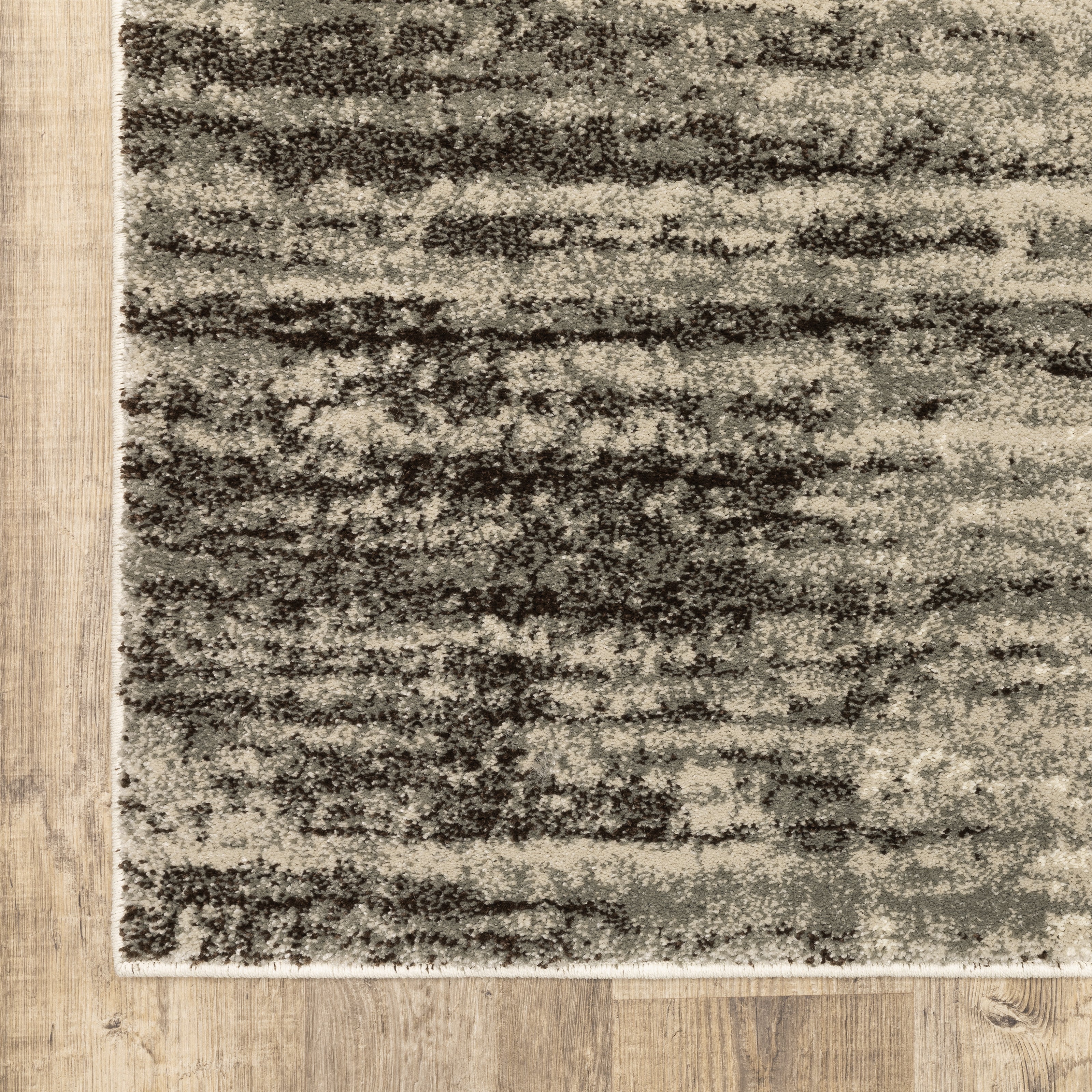 Oriental Weavers Carson 0735A plush modern rug featuring abstract pattern in beige/ grey tones