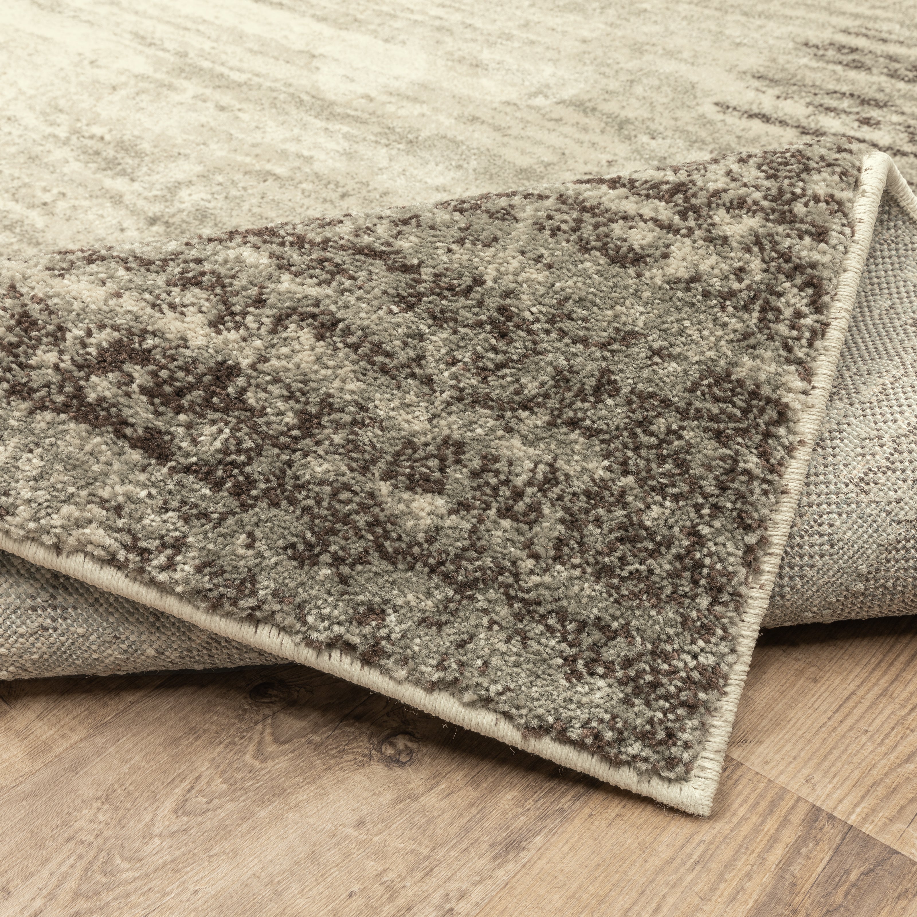 Oriental Weavers Carson 0735A plush modern rug featuring abstract pattern in beige/ grey tones