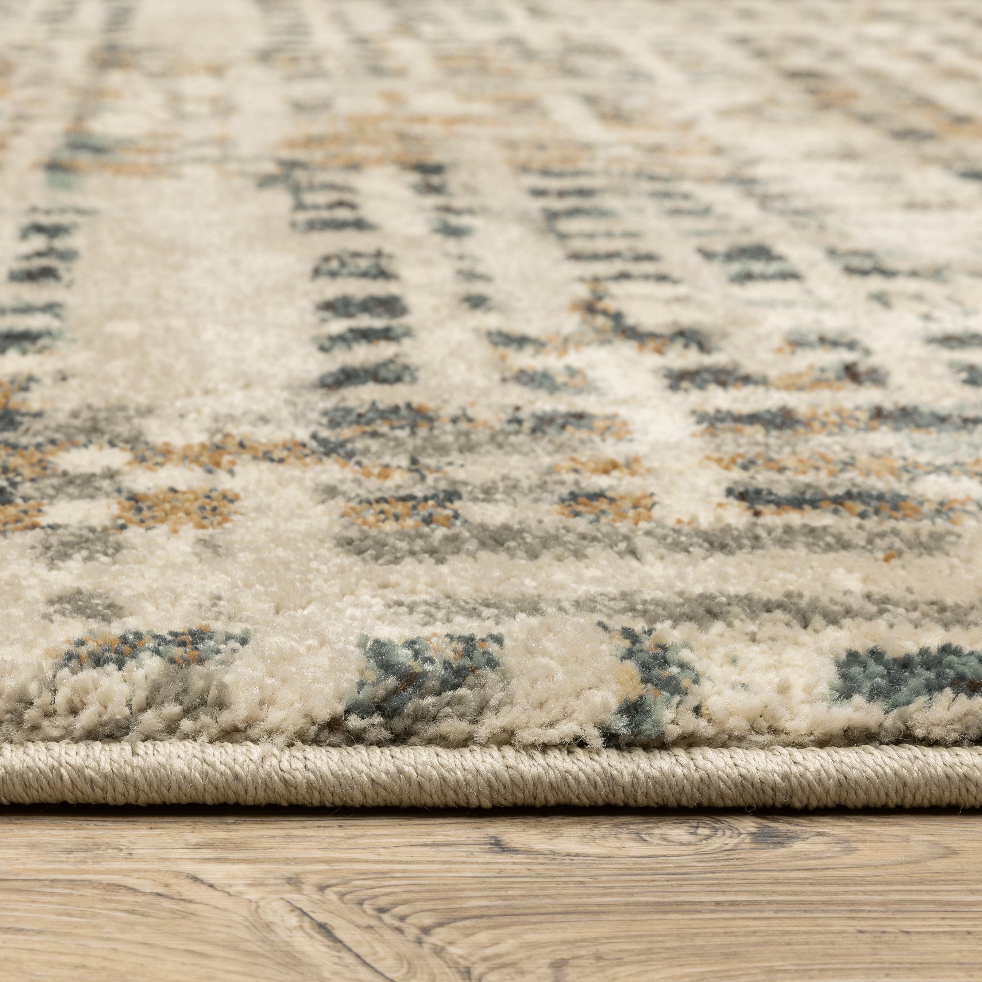 Oriental Weavers Carson 0748F plush modern rug featuring abstract pattern in beige/ grey tones
