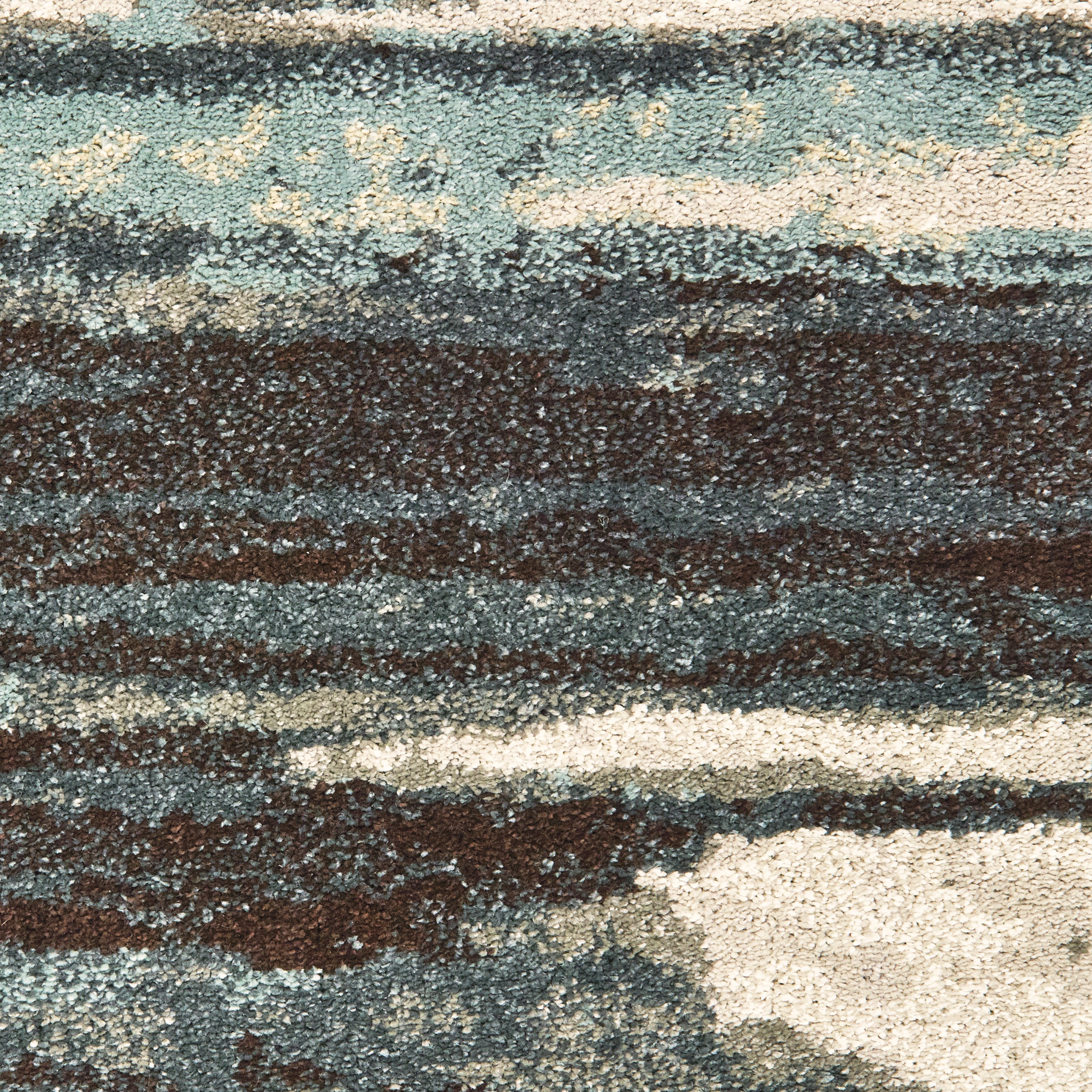 Oriental Weavers Carson 9675A plush modern rug featuring abstract pattern in blue/ brown tones