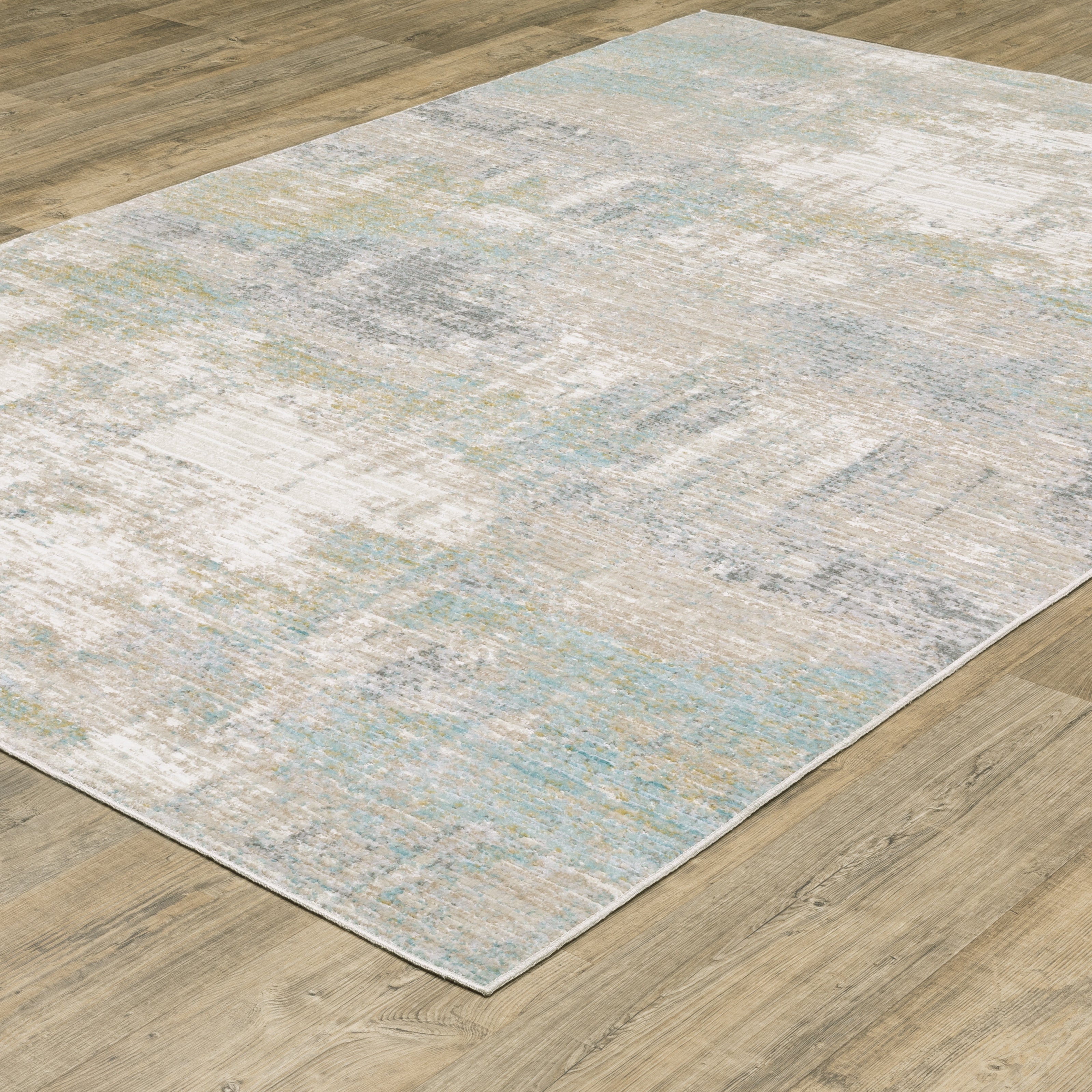 Oriental Weavers Cavett CAV01 soft transitional rug featuring decorative pattern in ivory/ teal tones